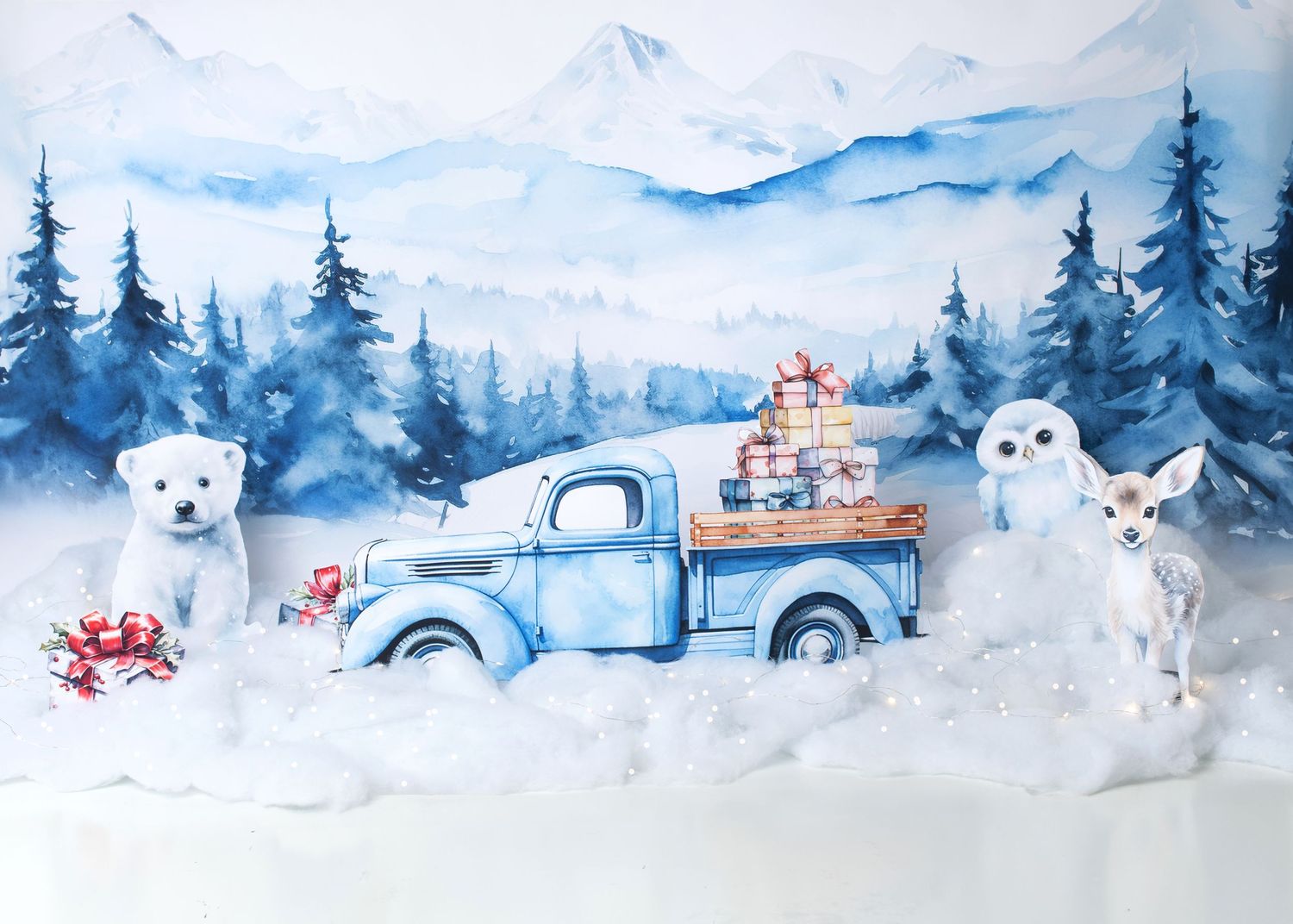 Winter wonderland first birthday cake smash setup with snowy blue decor in Linden, New Jersey.
