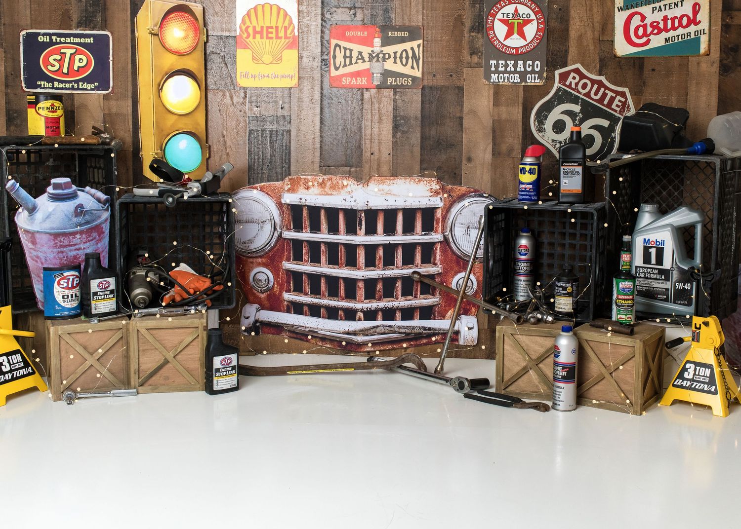 Race car first birthday cake smash setup with garage themed decor in Linden, New Jersey.
