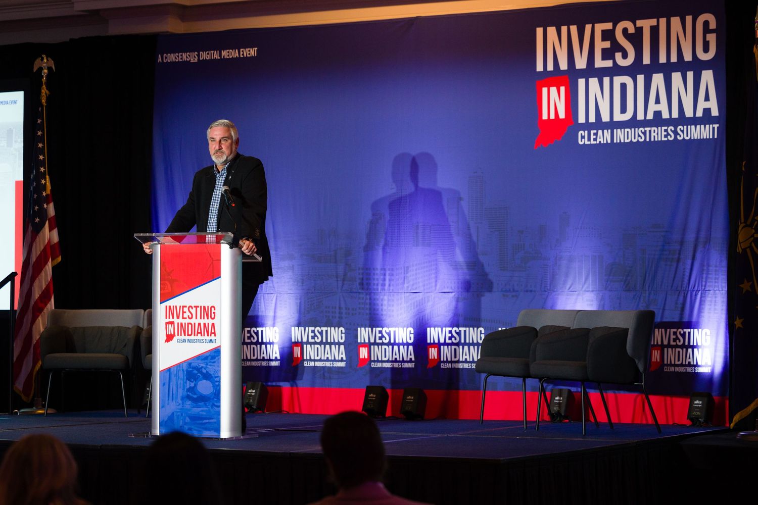 Governor Holcomb delivering speech about investing in Indiana.