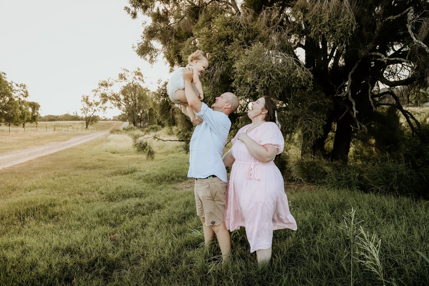 Sky High With Daddy During A Family Session On The Farm