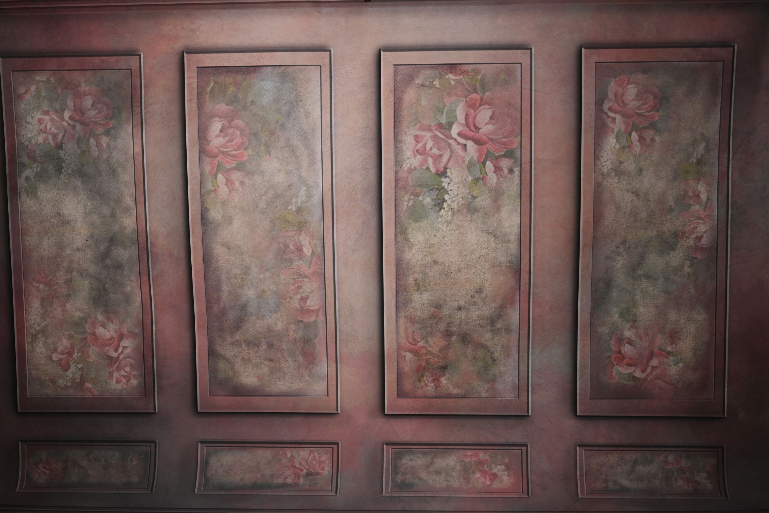 Dark wood paneled wall with vintage floral wallpaper pattern.