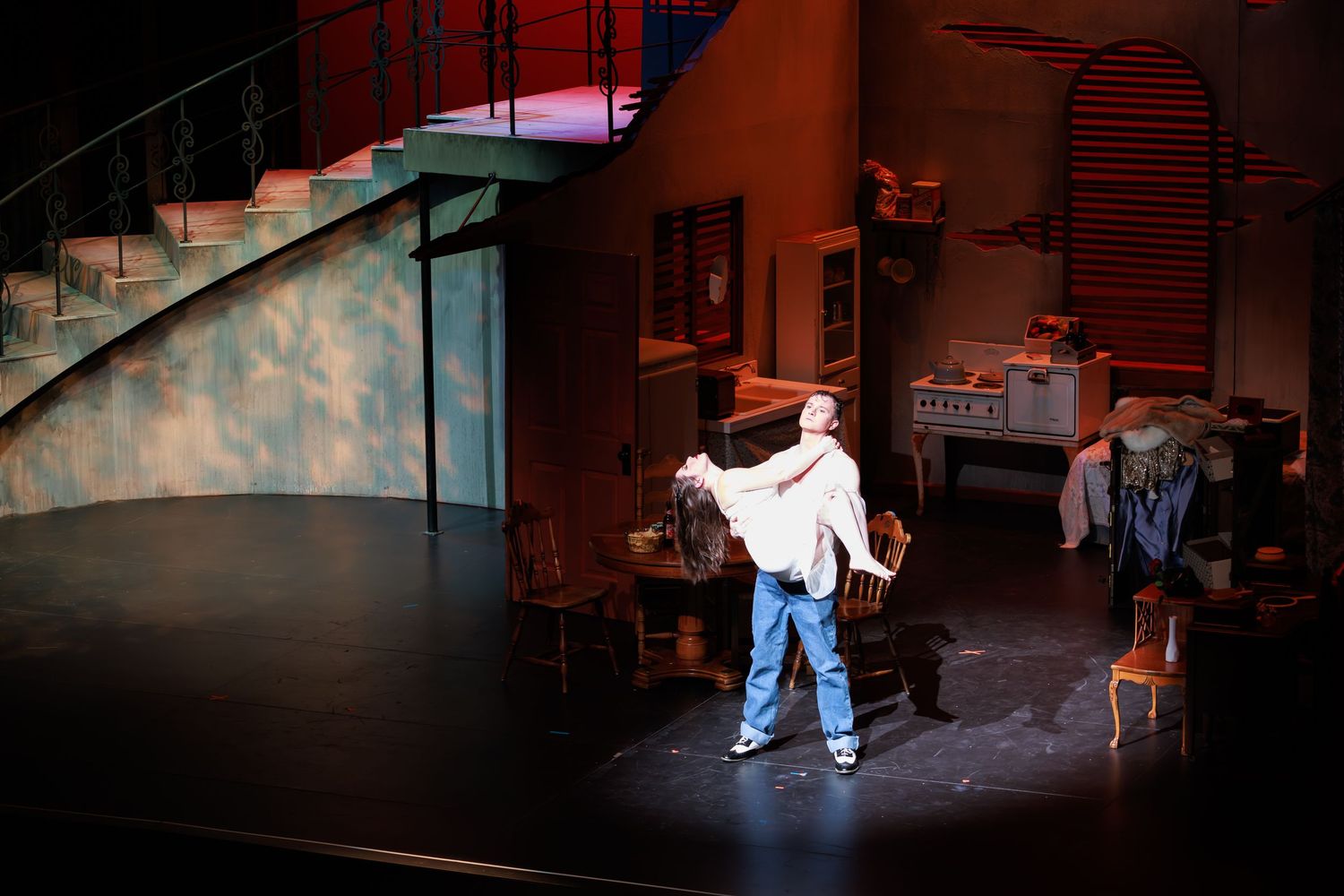 dramatic moment during live opera performance with rich stage backdrop