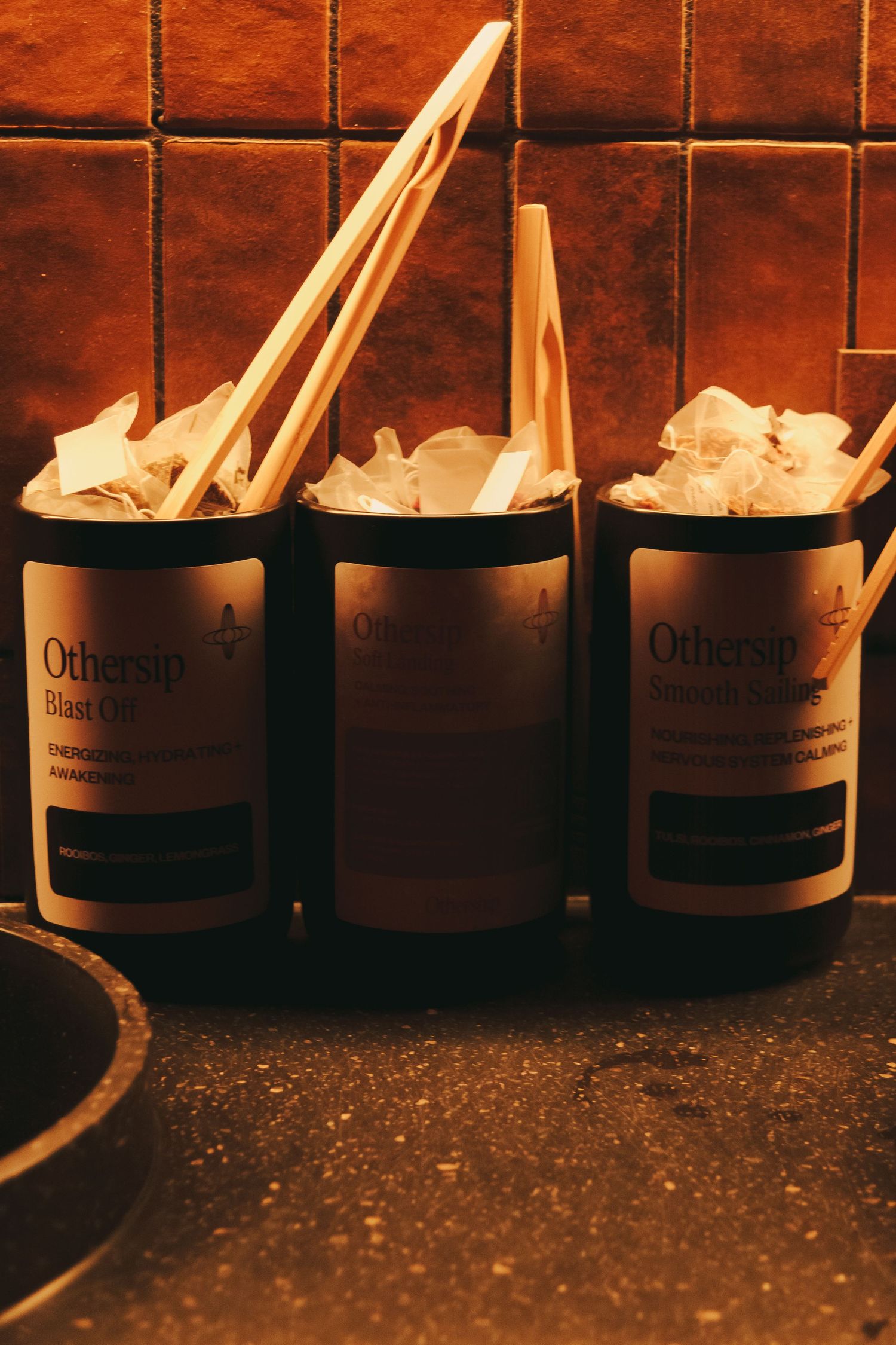 Minimalist spa lounge area with tea station at Othership Flatiron in Manhattan