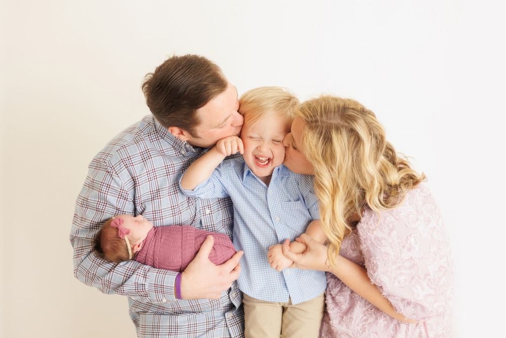 A sequence of four candid family photos showing playful moments and laughter on a light colored background.