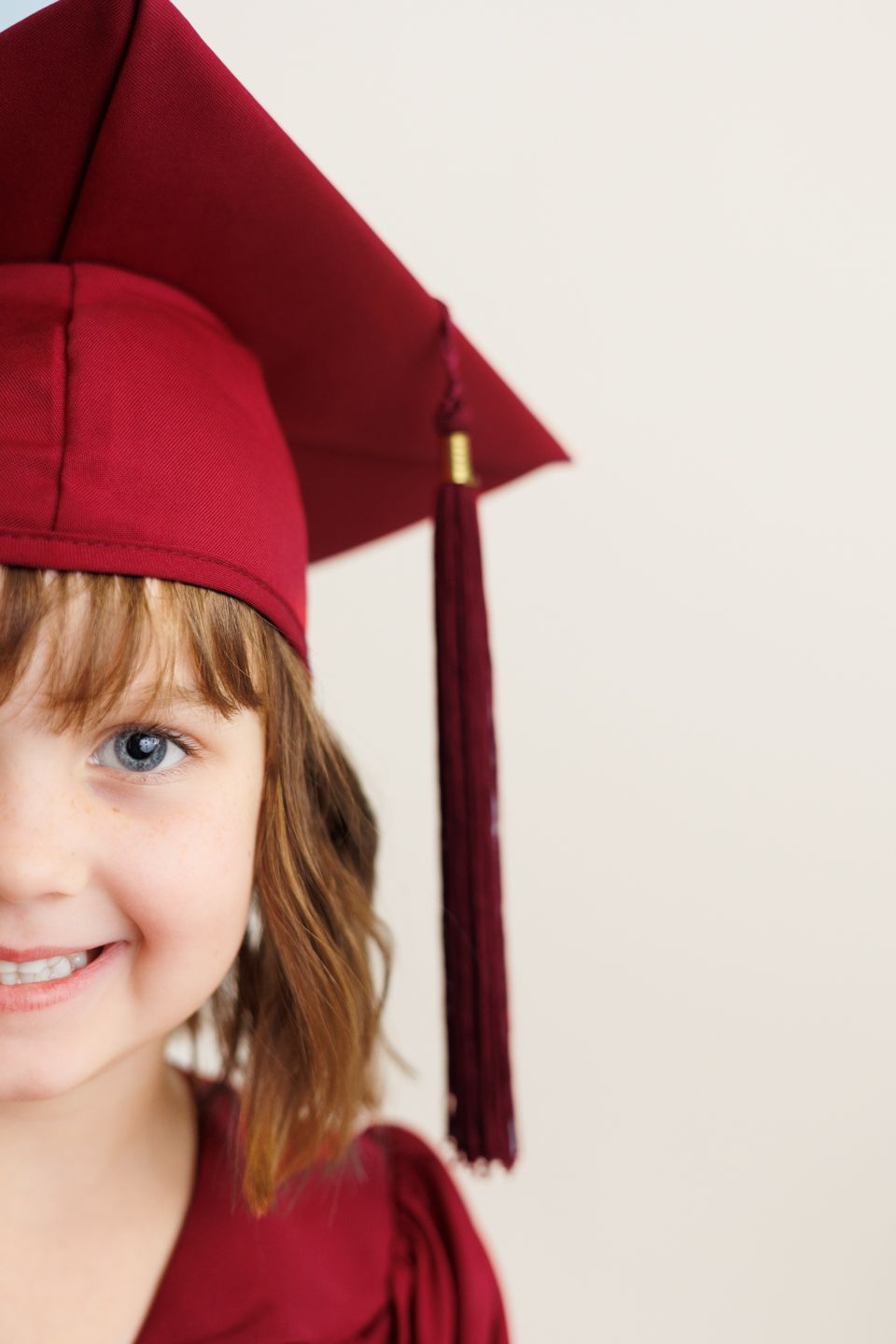 A person wearing a burgundy graduation cap with tassel shown in a series of cropped portrait views.