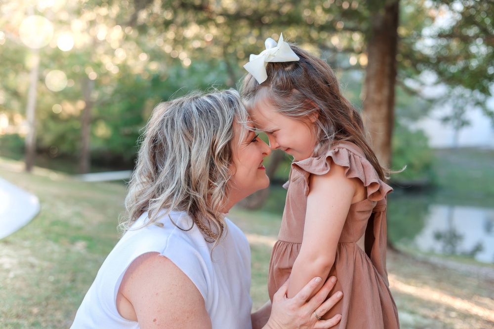 Precious moment shared between two generations outdoors on a sunny afternoon. Family photography session.