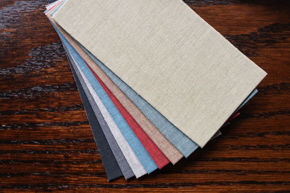 A set of fabric texture swatches in various colors arranged in a fan pattern.