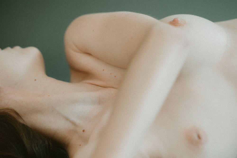 Intimate close-up portrait showing natural skin texture and form.