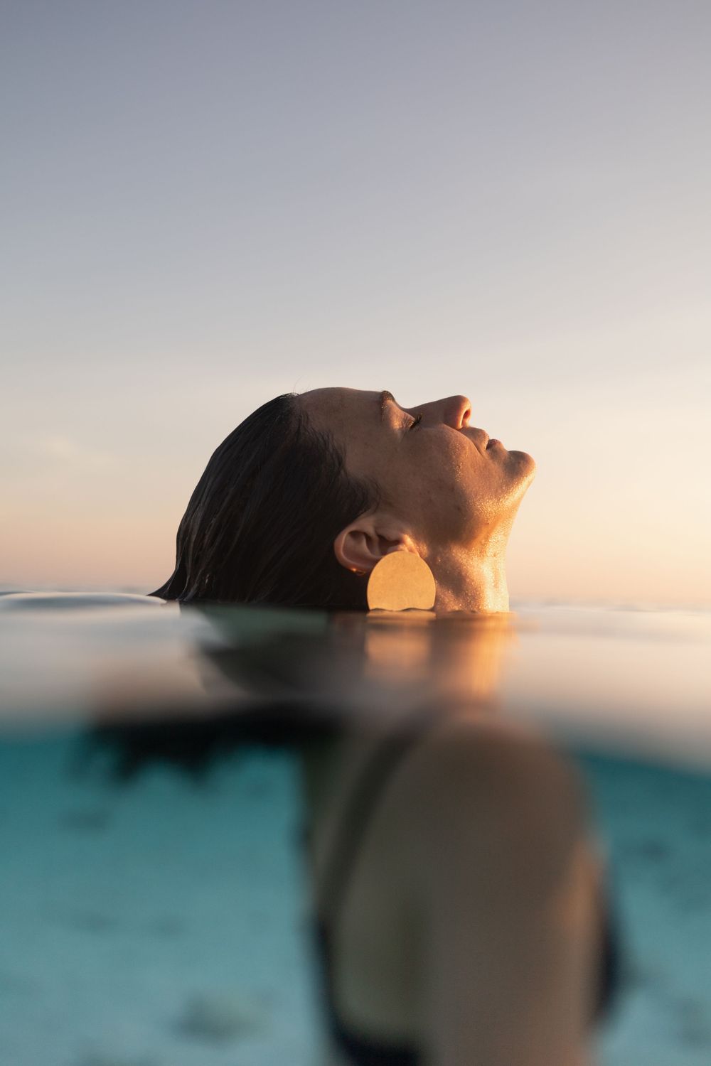 woman standing in water on Maui