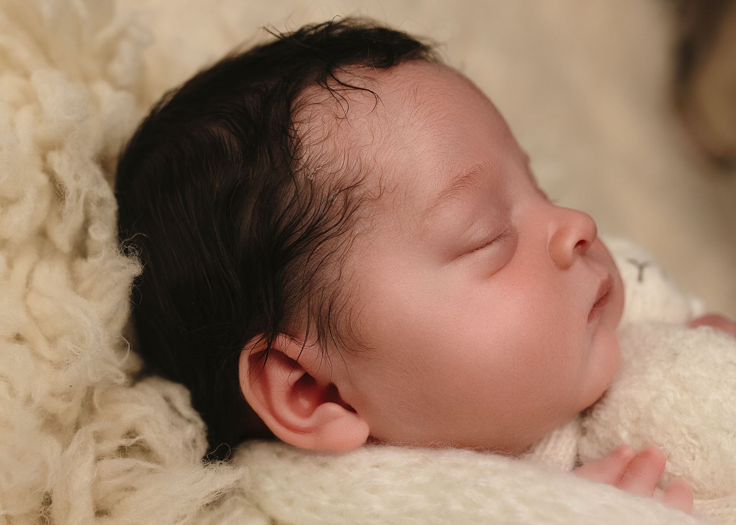 Charlottesville photographer, newborn, maternity, family, detail, close-up shot of baby girl seeping against a neutral backdrop.