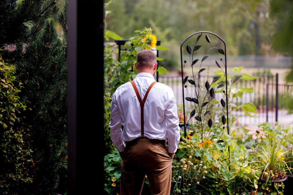 Groom waiting for first look of bride