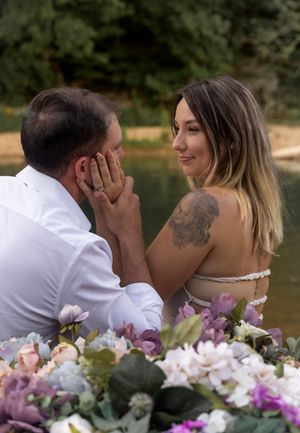 Romantic boat scene with vibrant purple and white flowers arranged along the bow.