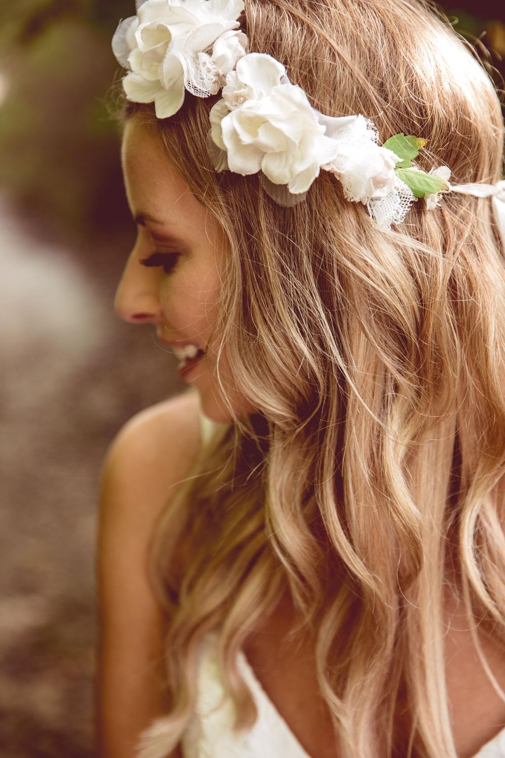 Close-up series showing wavy blonde hair adorned with delicate white floral crown in romantic bridal style.