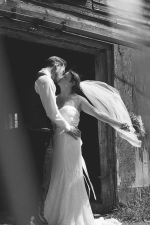 A sequence of black and white wedding photos showing a couple's silhouettes against a rustic wooden backdrop.