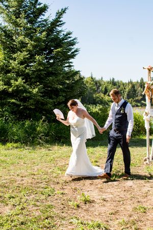 A playful sequence of wedding photos showing a couple dancing and posing in a grassy field.