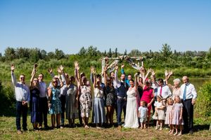 Panoramic wedding party group photos with guests lined up against natural outdoor landscape.