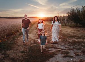 Candid walking shots of people along a dirt path during golden hour.