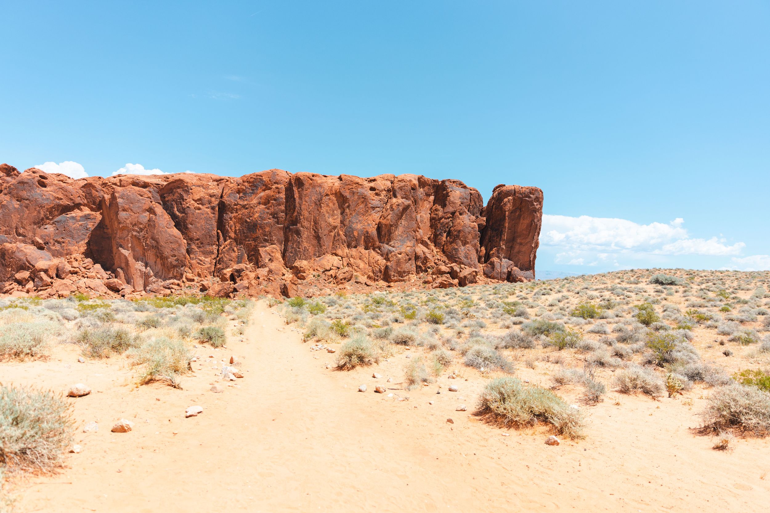 Panoramic view of red rock formations in desert landscape.