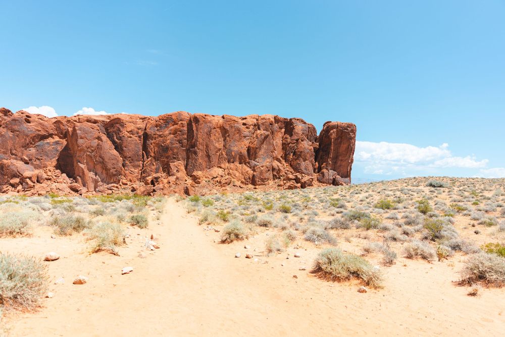 Panoramic view of red rock formations in desert landscape.