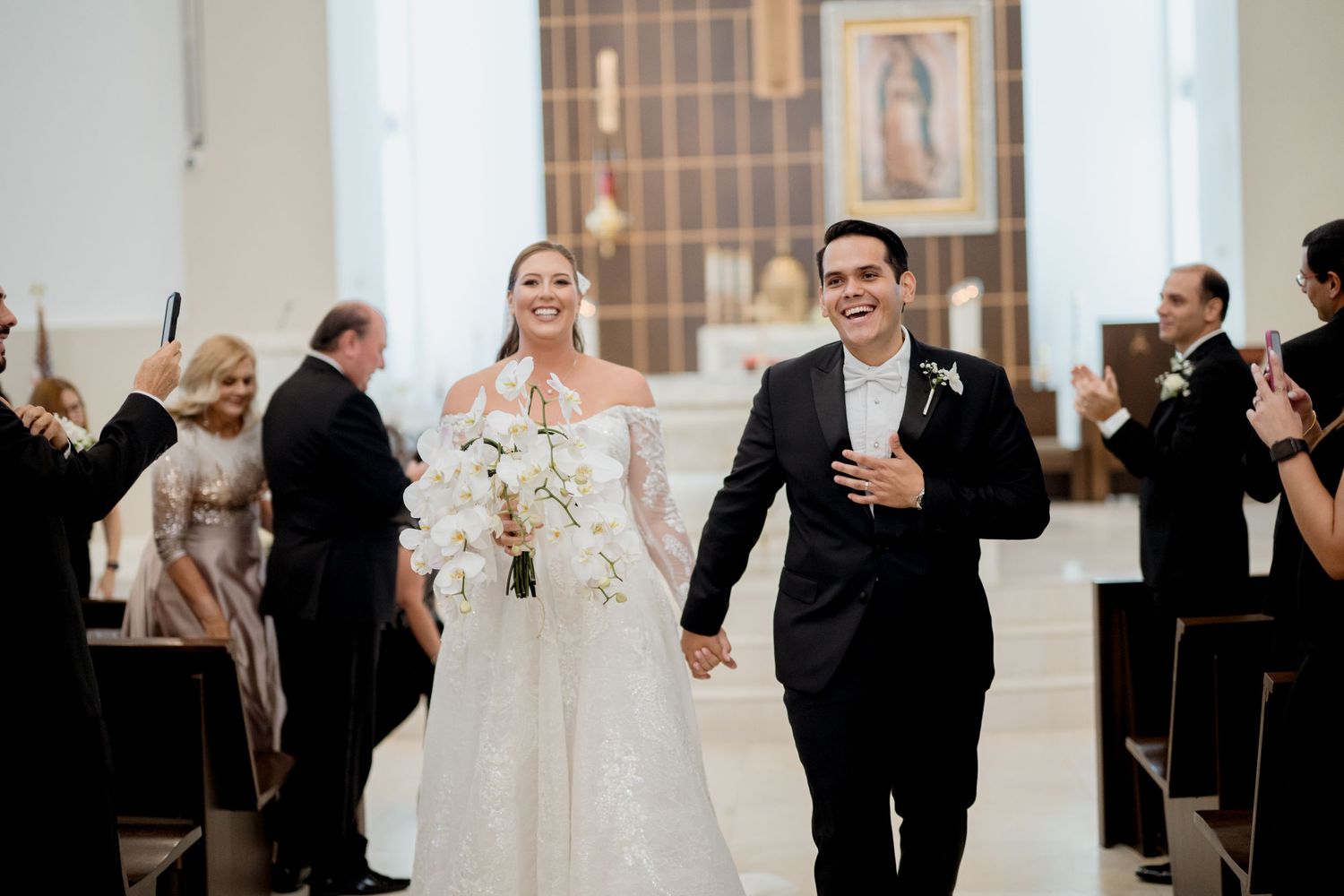 Wedding celebration photos showing joyful moments of dancing and embracing at an elegant indoor reception venue.