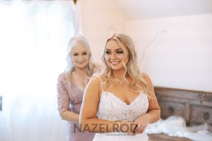 Wedding photograph of mother getting daughter ready