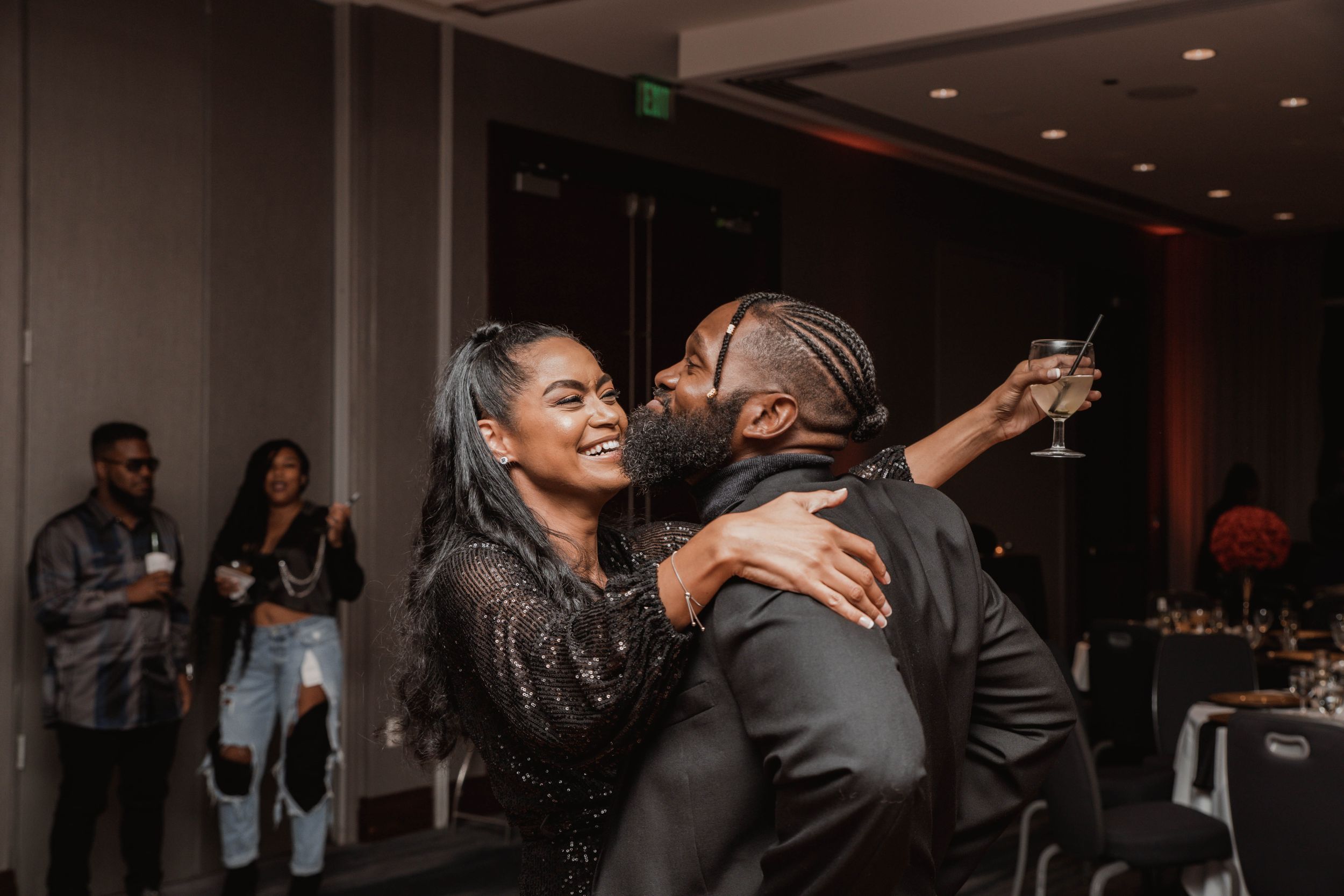 Couple sharing an intimate dance moment at an elegant evening celebration.