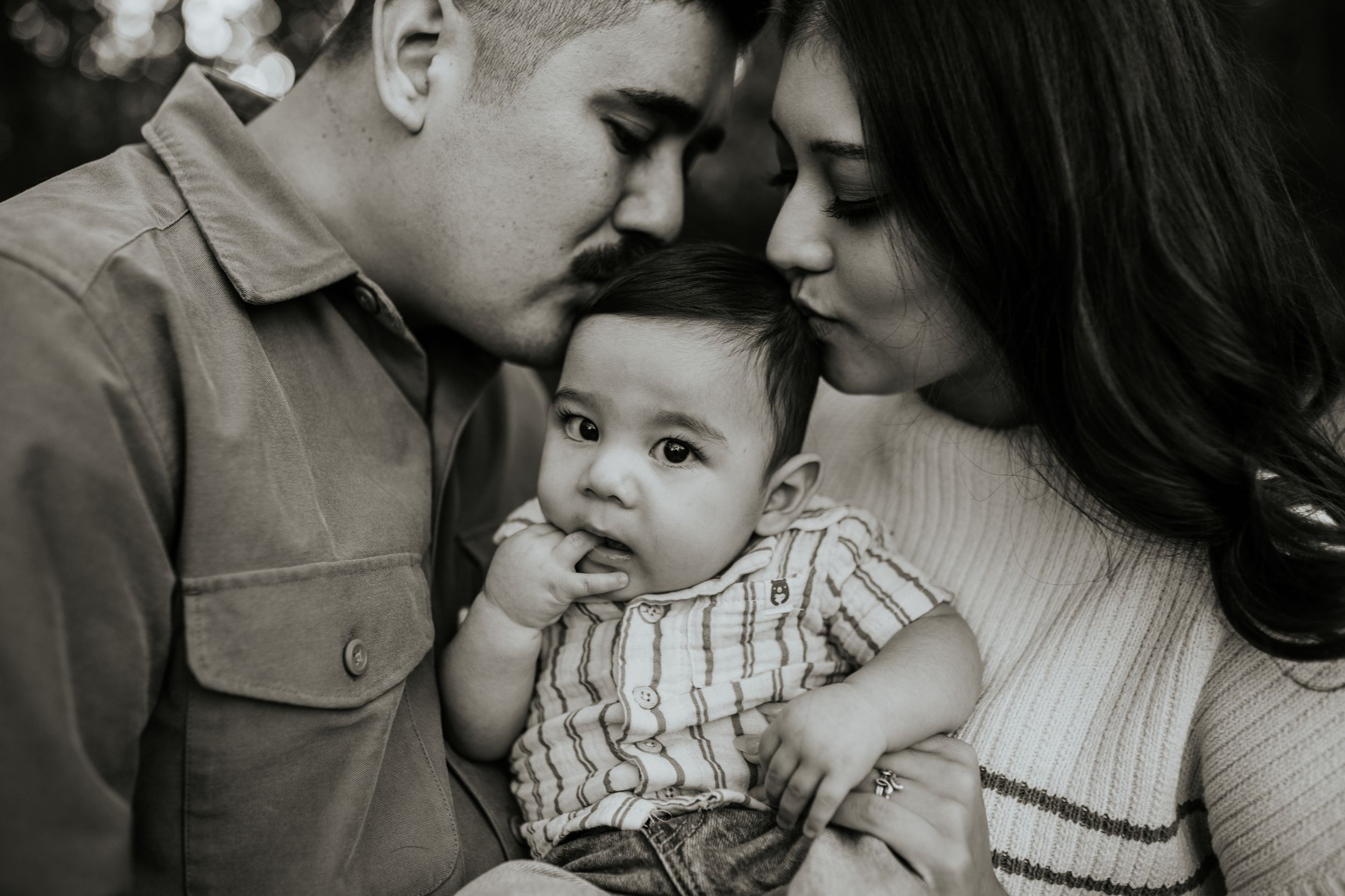 Intimate black and white family portrait showing tender moments.