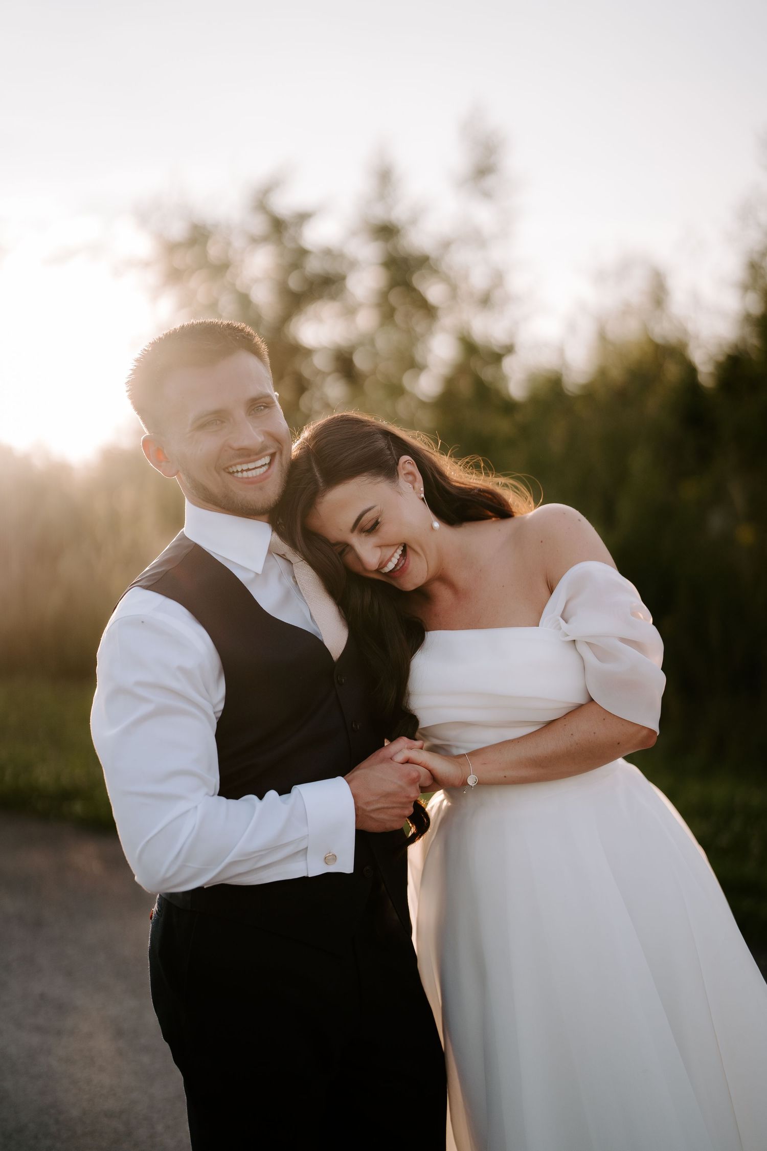 bride and groom laughing during sunset at yardspace old gore in cirencester