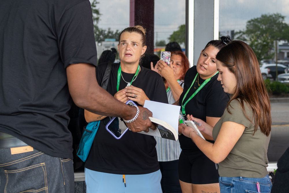 Conference attendees network and socialize during a professional event.