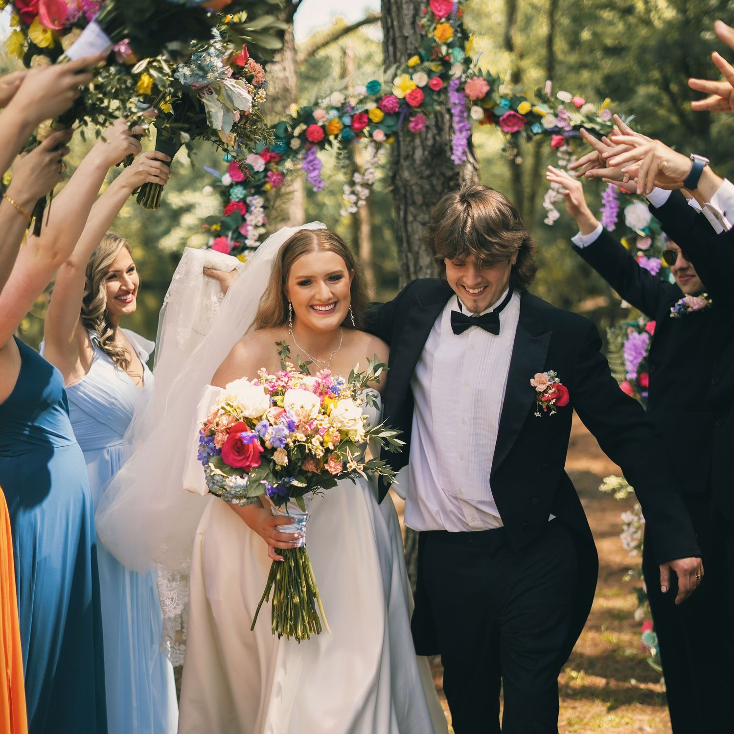 Luxury spring themed wedding with couple and full bridal party captured by The Fuller Effect Photography, a luxury photography business.
