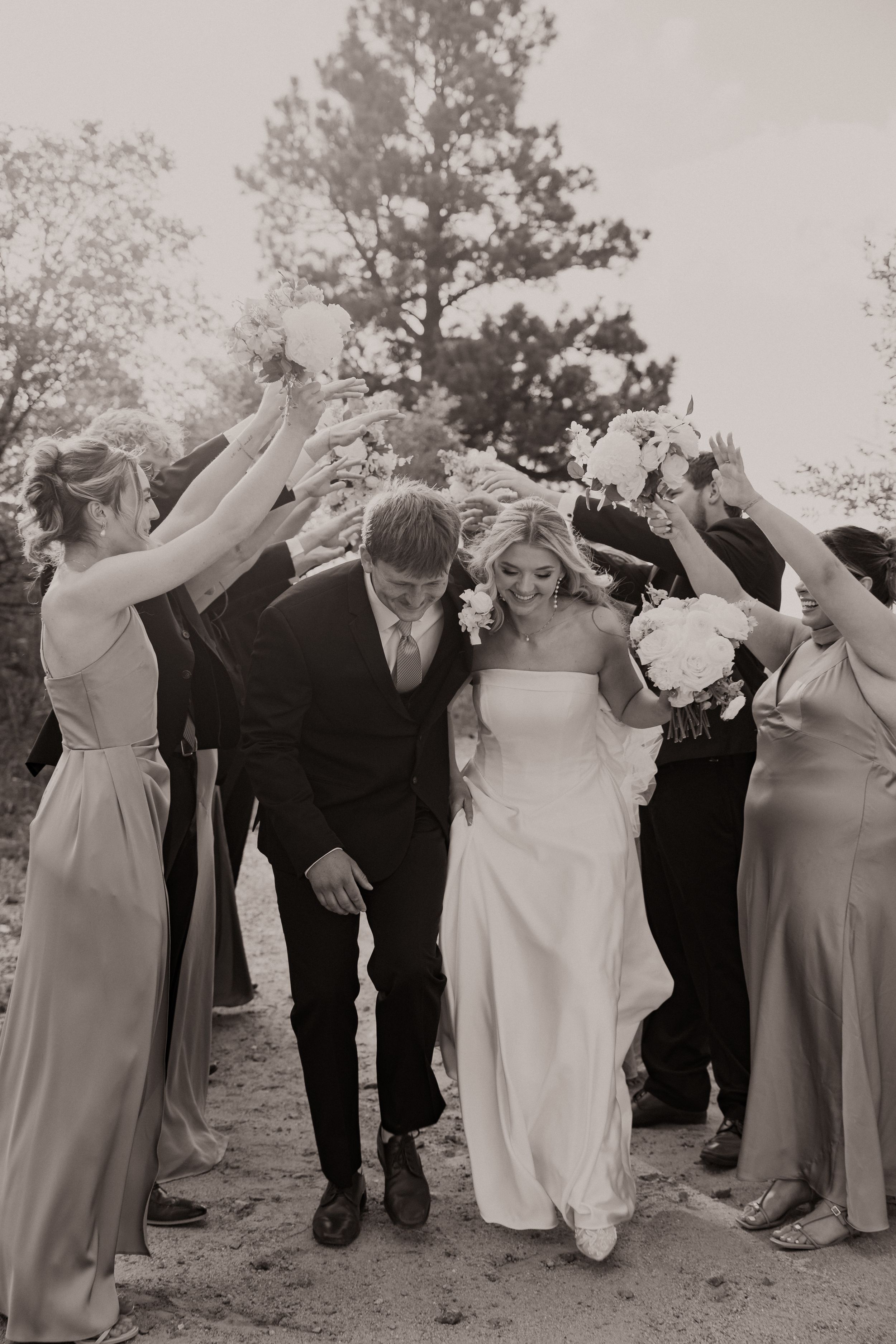 Black and white romantic wedding photo series showing a couple embracing and kissing in four intimate moments.
