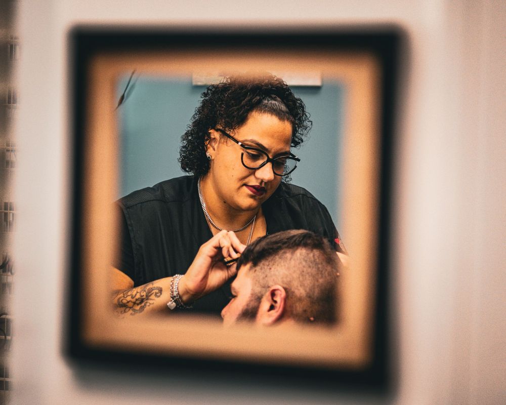 Professional grooming session captured through vintage photo frame effect.