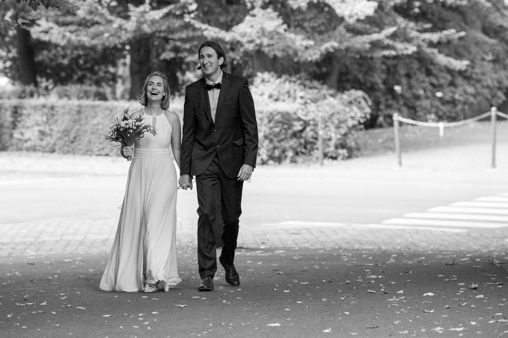 Wedding couple taking romantic outdoor photos in black and white.