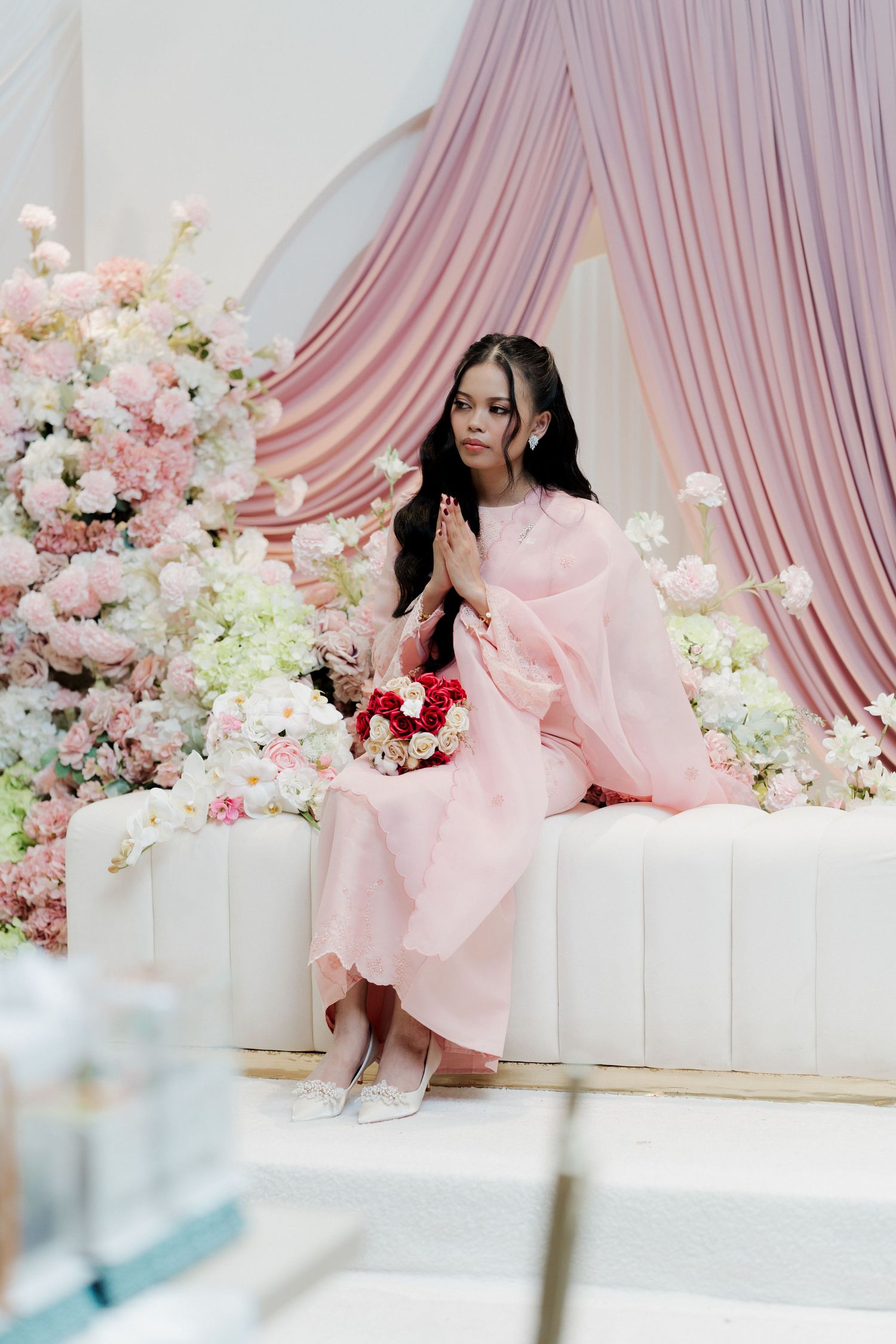 Close-up shots of hands exchanging rings during an intimate ceremony.