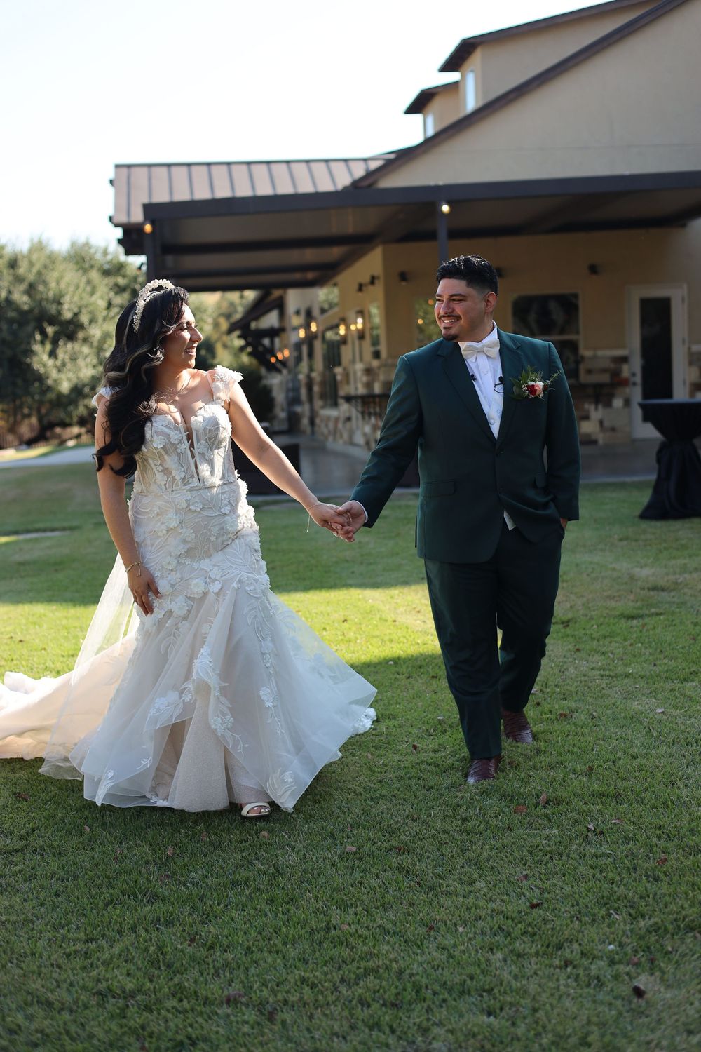 A sequence of playful bride and groom poses on a grassy lawn outside a rustic venue shows joyful wedding day moments.