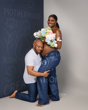 A maternity photo series against a dark chalkboard wall with floral drawings shows loving embraces and tender moments.