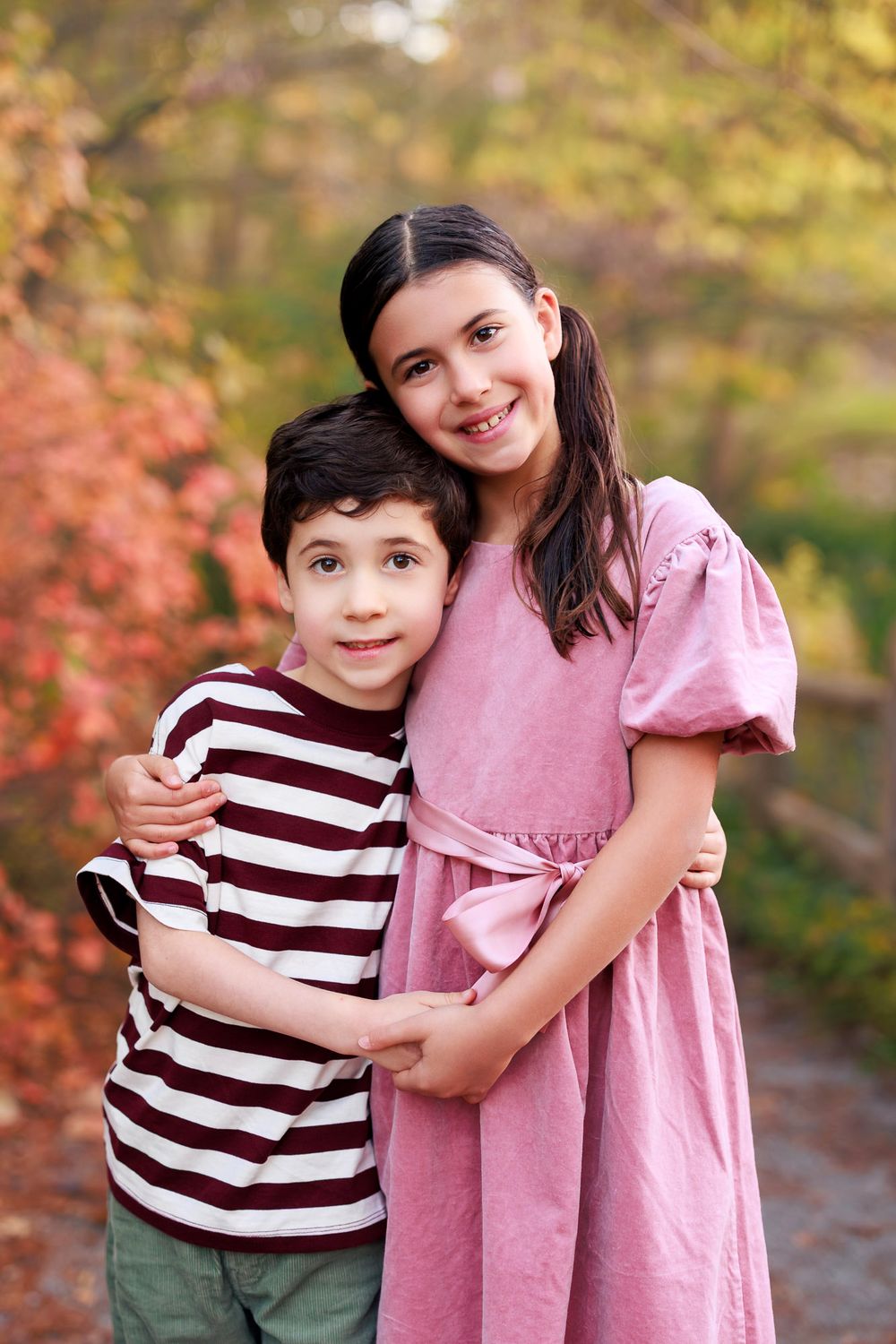 Sibling portrait of two children during an outdoor fall family photography session in Toronto