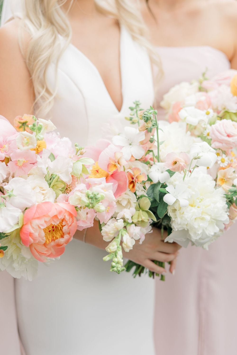 Bride and bridesmaids with pastel flowers