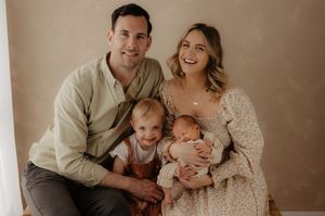 Heartwarming family studio portraits in neutral colors.