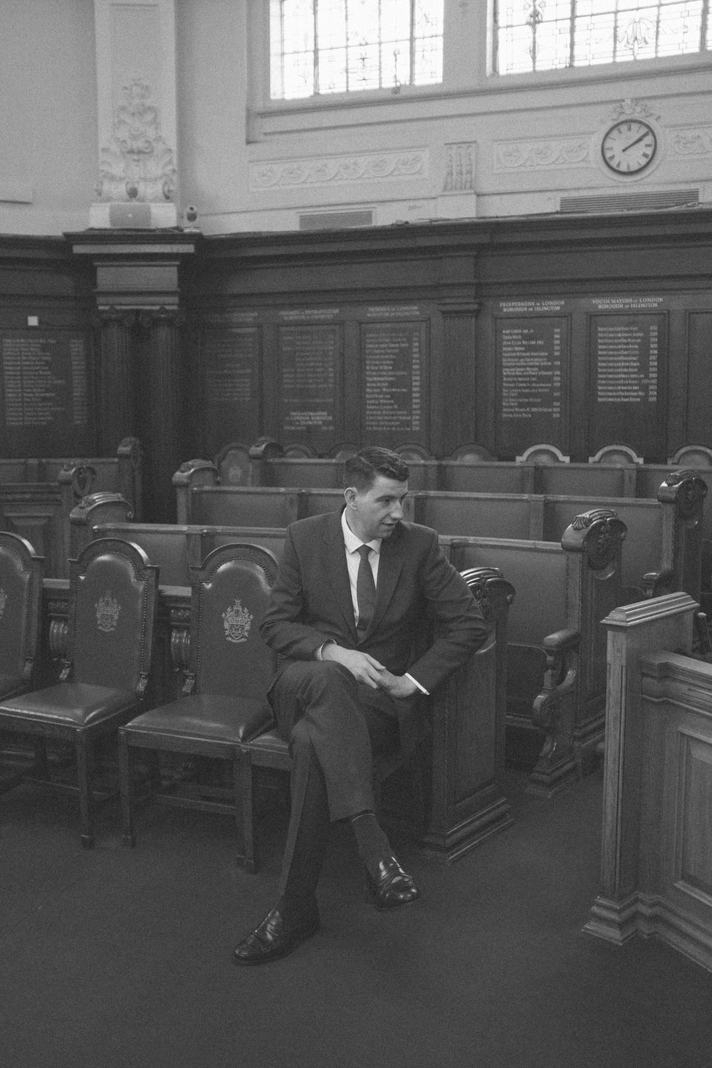Groom sits in Islington Town Hall waiting for his bride.