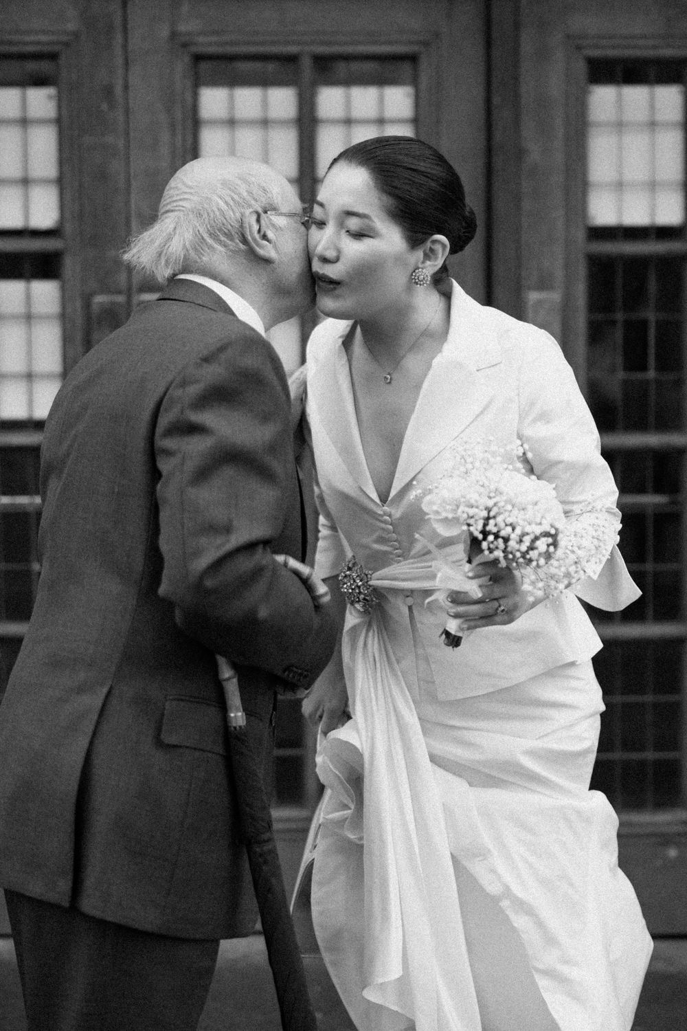 Bride greets a guest at Islington Town Hall wedding.