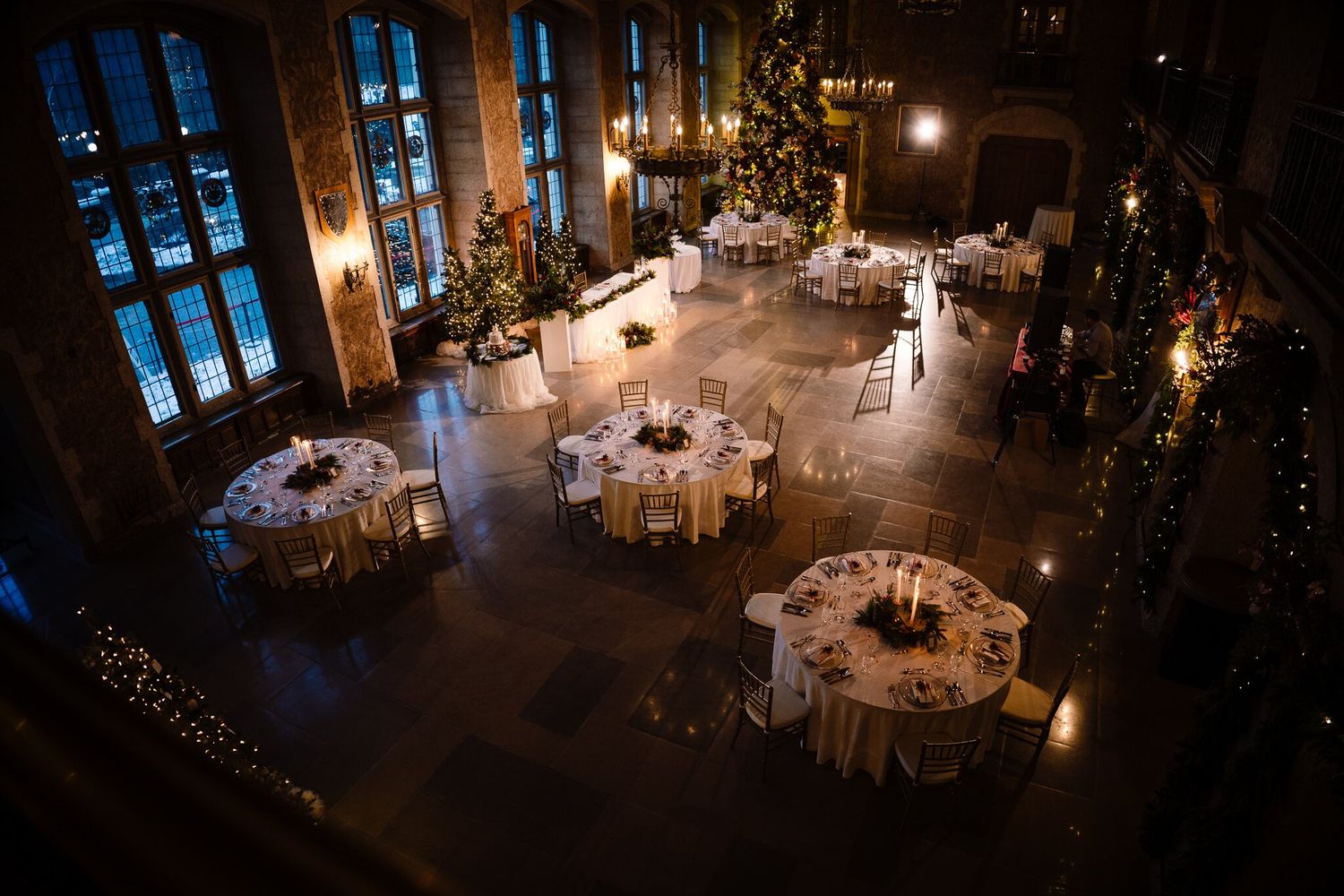 Candlelit Christmas wedding reception in Mount Stephen Hall at the Fairmont Banff Springs, seen from above