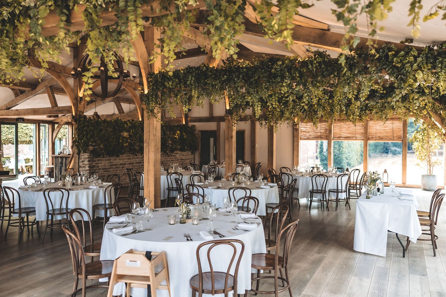 Oak Room set for a wedding breakfast at Hazel Gap Barn