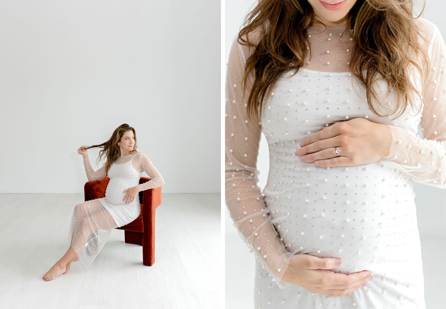 Pregnant woman in white polka dot sheer maternity dress posed in studio, showcasing baby bump in elegant maternity photos.