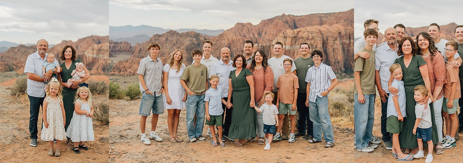 Large family posing outdoors in a desert landscape with red rock formations in St. George, Utah.