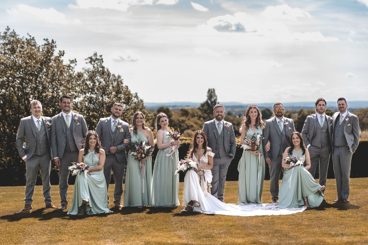 Formal group shot of the bridal party after the wedding ceremony