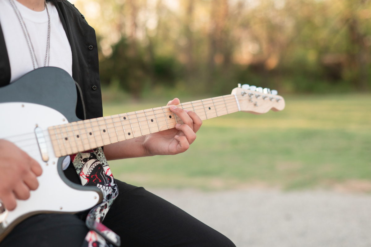 Senior Guy with His Car and Guitar in Downtown Bartlesville by Bartlesville Senior Photographer Kristi Bray