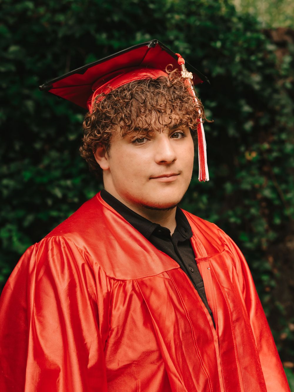 Mens graduation cap & gown senior photos on campus