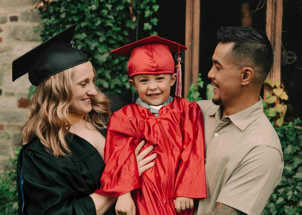 Preschool graduate & college graduate family photos in caps & gowns