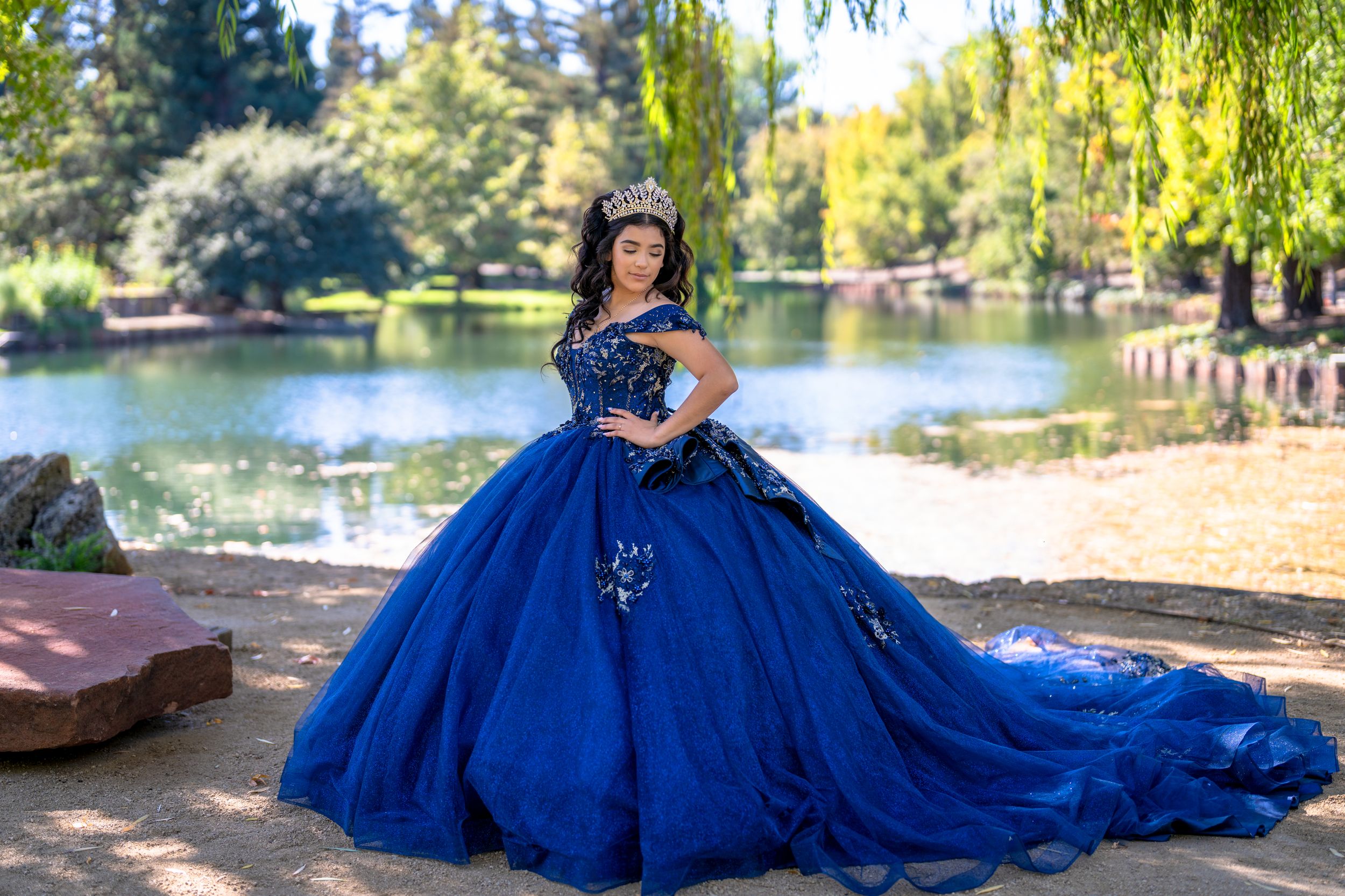 Quinceañera posing near lake